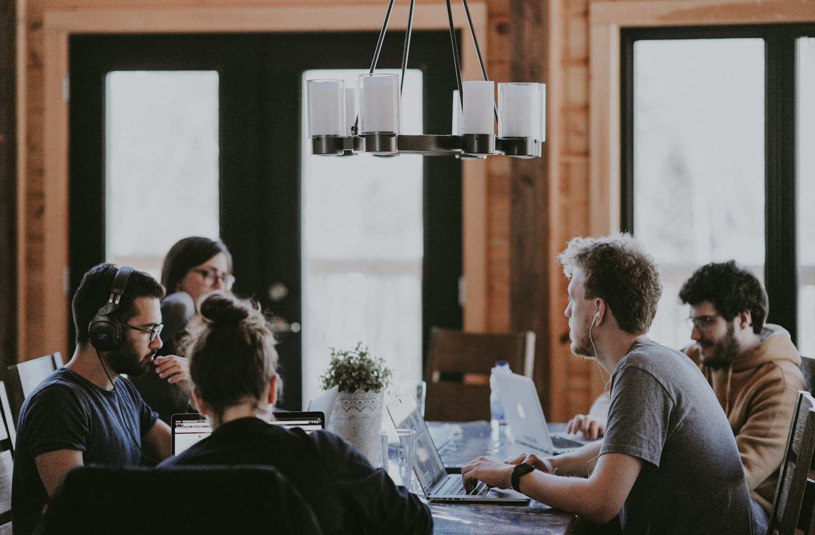 Researchers collaborating around a table — tiered mentorship in action